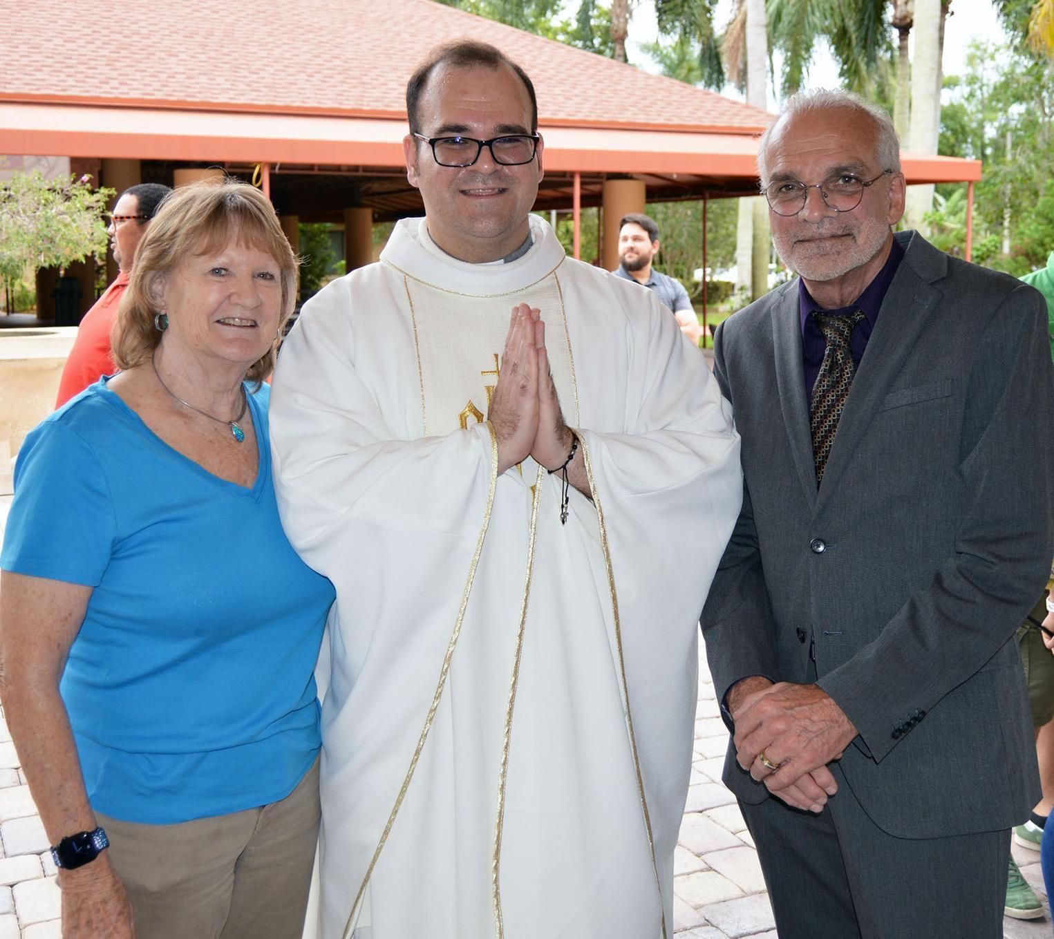 Divine Word Father Brian Junkes poses with his parents, Ann and Harald Junkes, after Mass at Our Lady Queen of the Apostles in Royal Palm Beach.