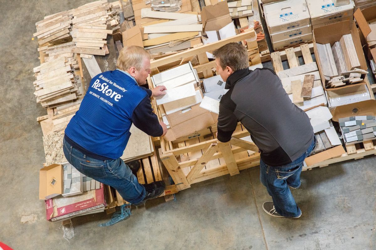 Volunteer helping customer at the ReStore