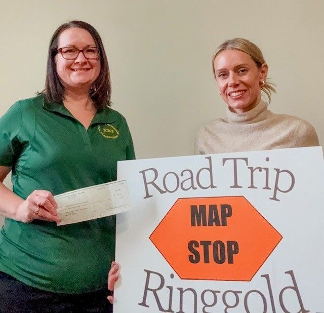 Danielle Gives a Check to Nicole with Ringgold County Development
