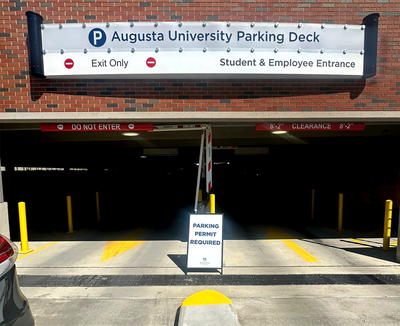 Custom ADA-compliant signs including restroom, wayfinding, and room identification signs for a medical office