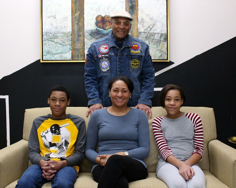 Ken, Alicia, and their children pose for a photo at Habitat for Humanity of Greater Dayton's offices.