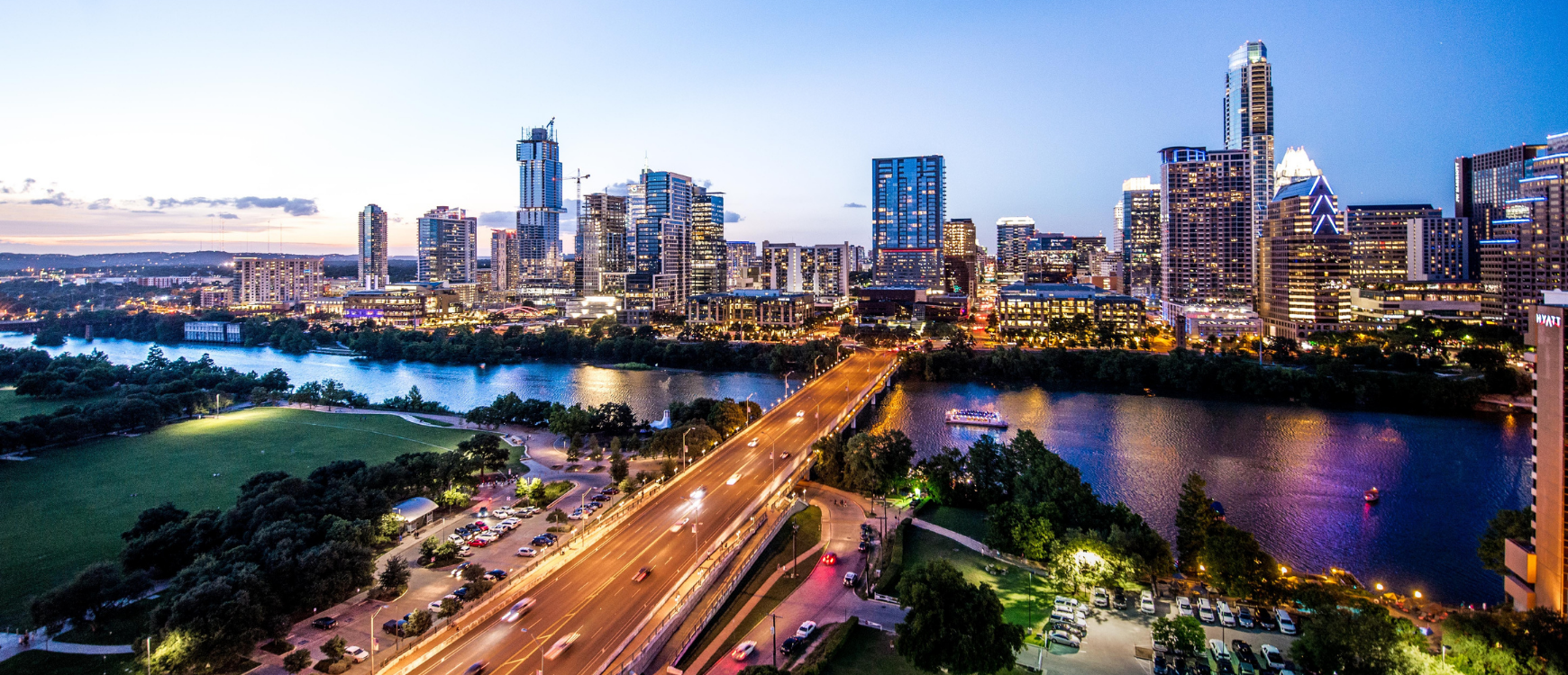 View of Austin skyline, the river and and a road leading into the city