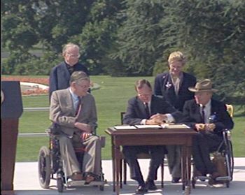 George Bush signing the ADA