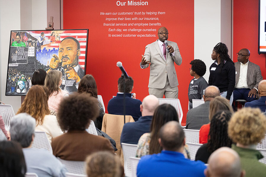 Peter Ferguson and Rally scholars present the Rev. Dr. Martin Luther King, Jr. Youth Rally mural, commissioned by artist Jevon Woods.