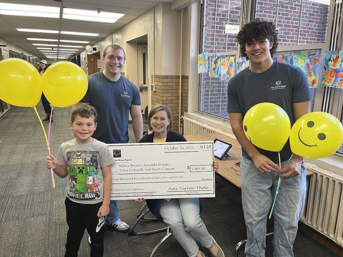 photo of students with big check