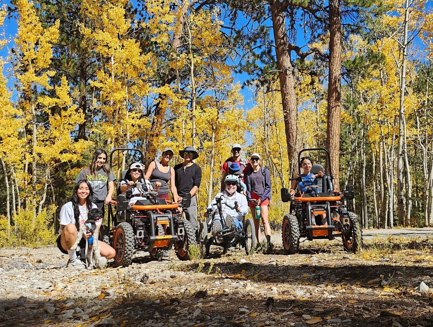 Group enjoying multiple types of adaptive equipment to hike the Lower Bristlecone Trail at Lee Canyon in the Spring Mountains outside Las Vegas. 