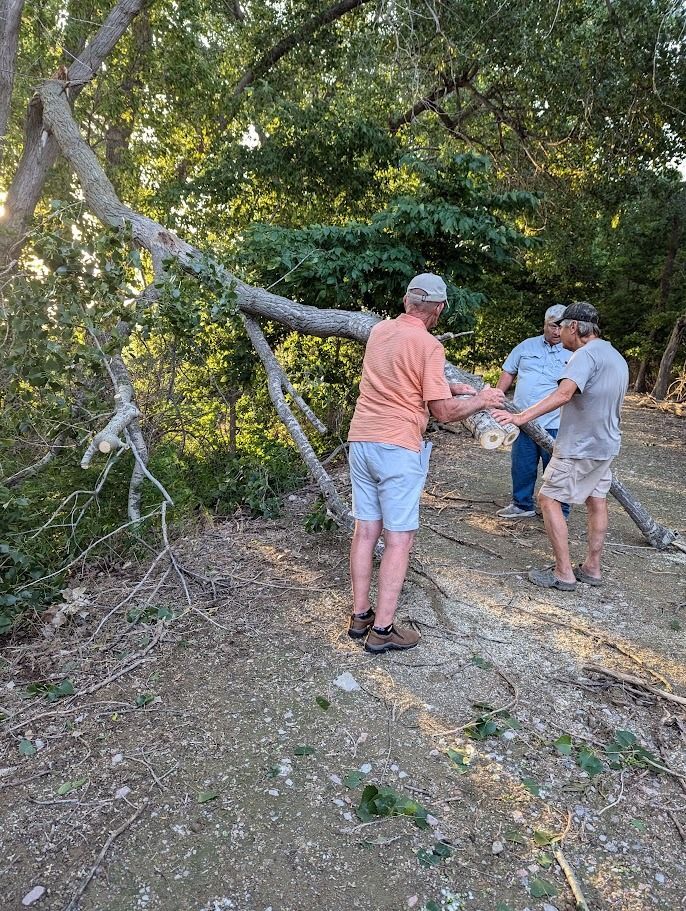 Dark Island Trail volunteers clearing a downed branch