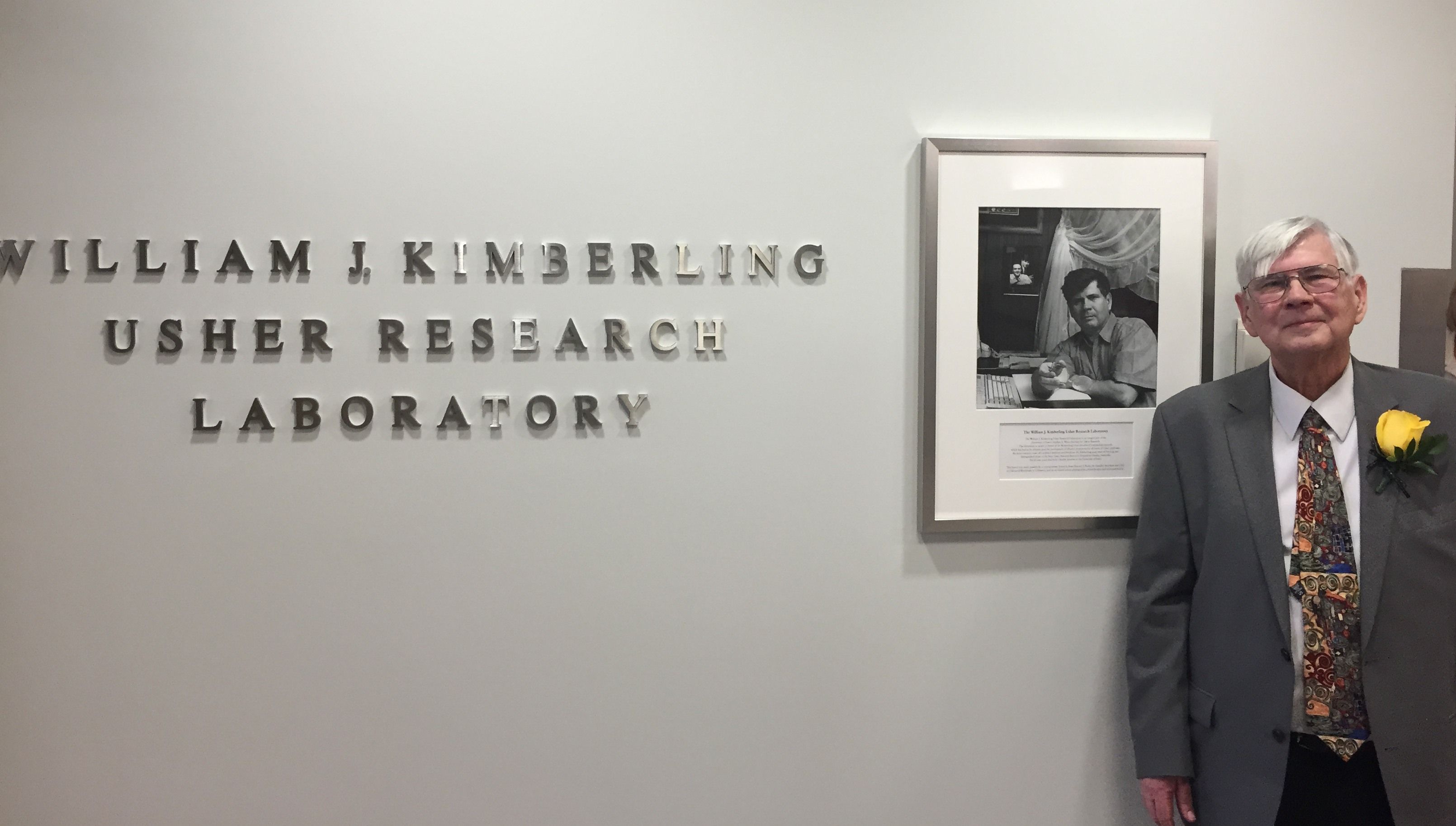 A picture of William J. Kimberling standing in front of his office for Usher Syndrome Research lab
