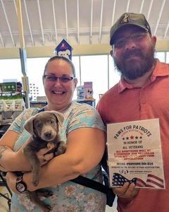 Veteran and family adopting a pet