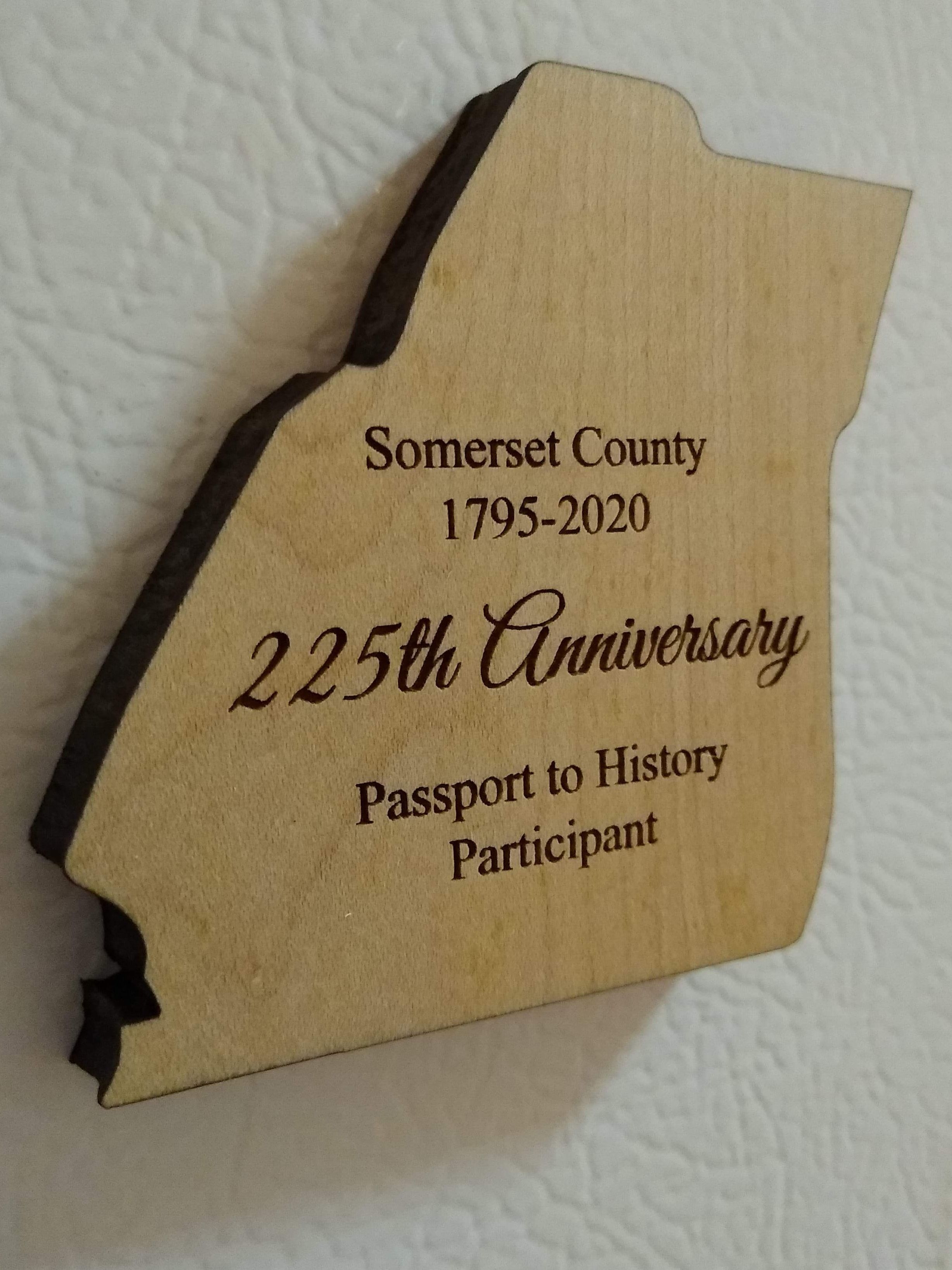 Laser cut keepsake shaped like the borders of Somerset County