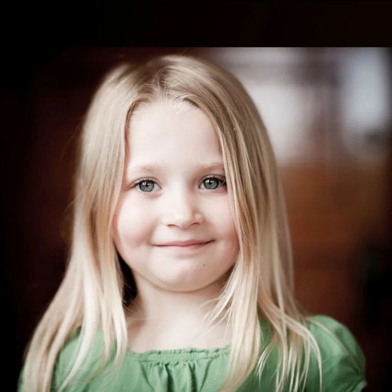 Little girl smiling.