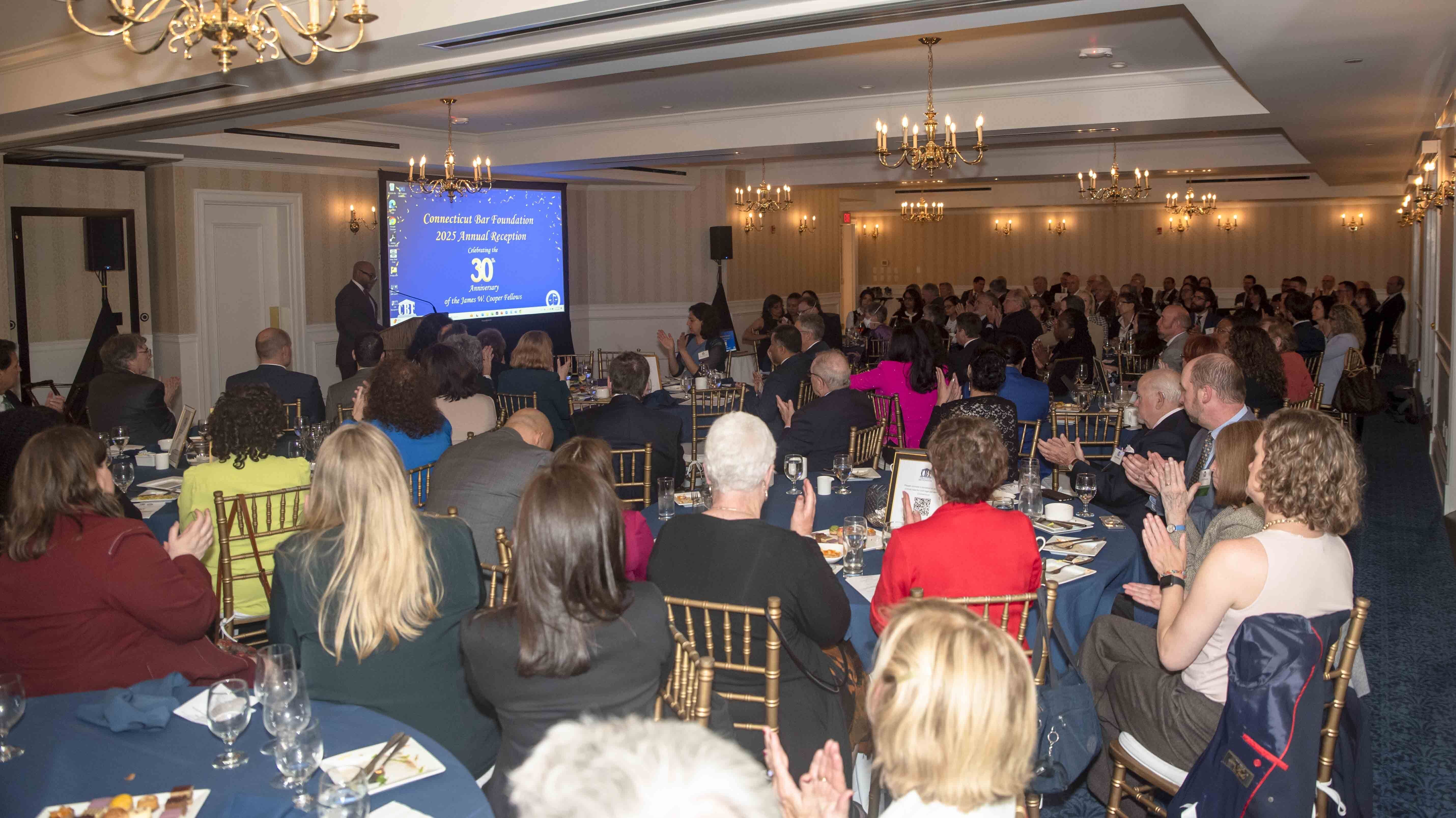 Wide shot of reception during dinner and keynote address.