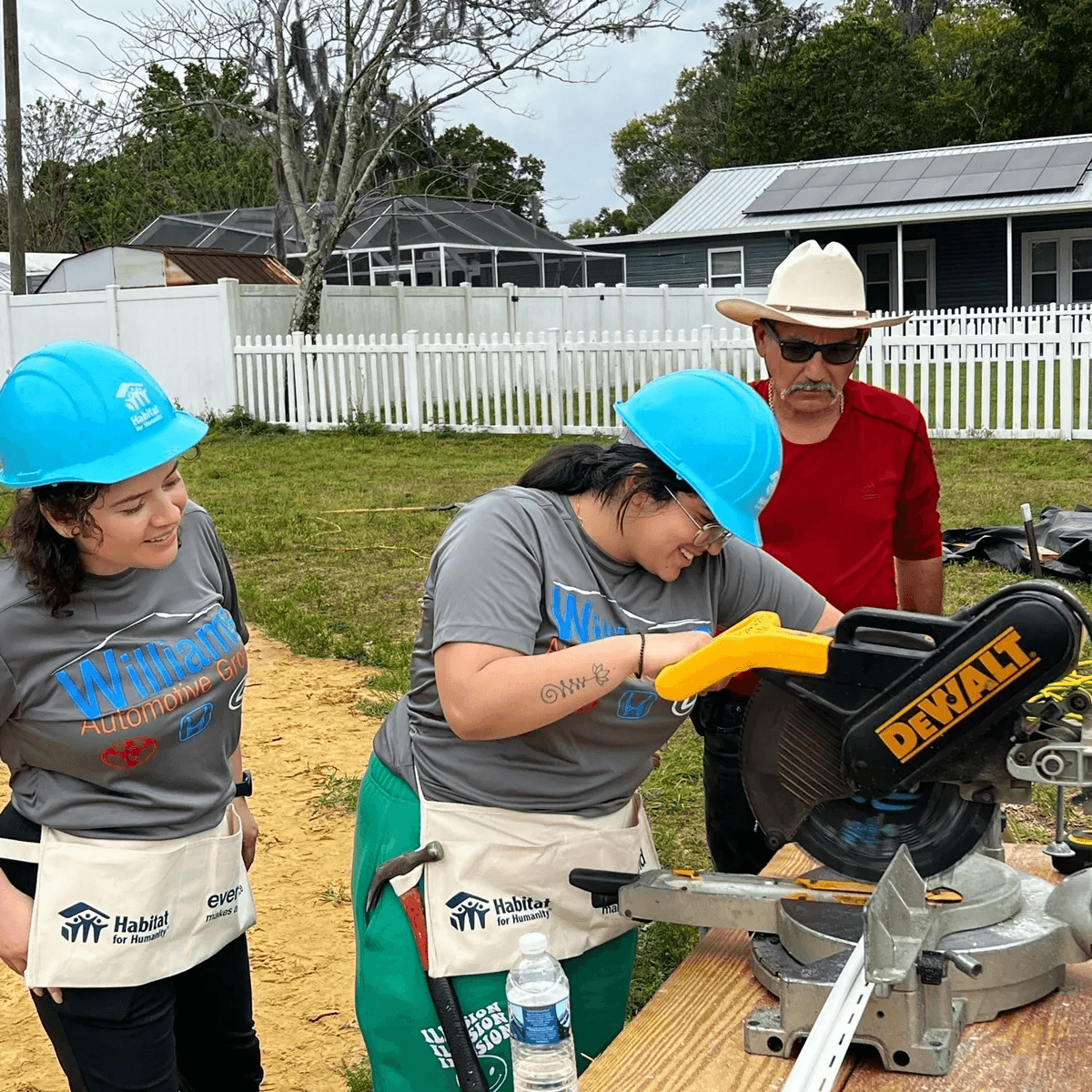 volunteer using a power tool.