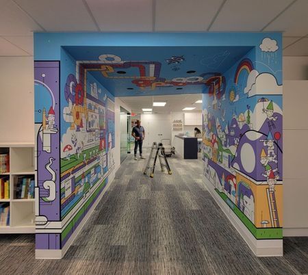 Hallway with bright colored wall and ceiling decals