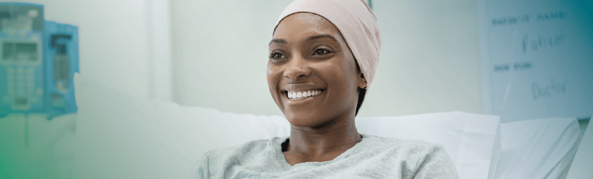 cancer patient in hospital room smiling
