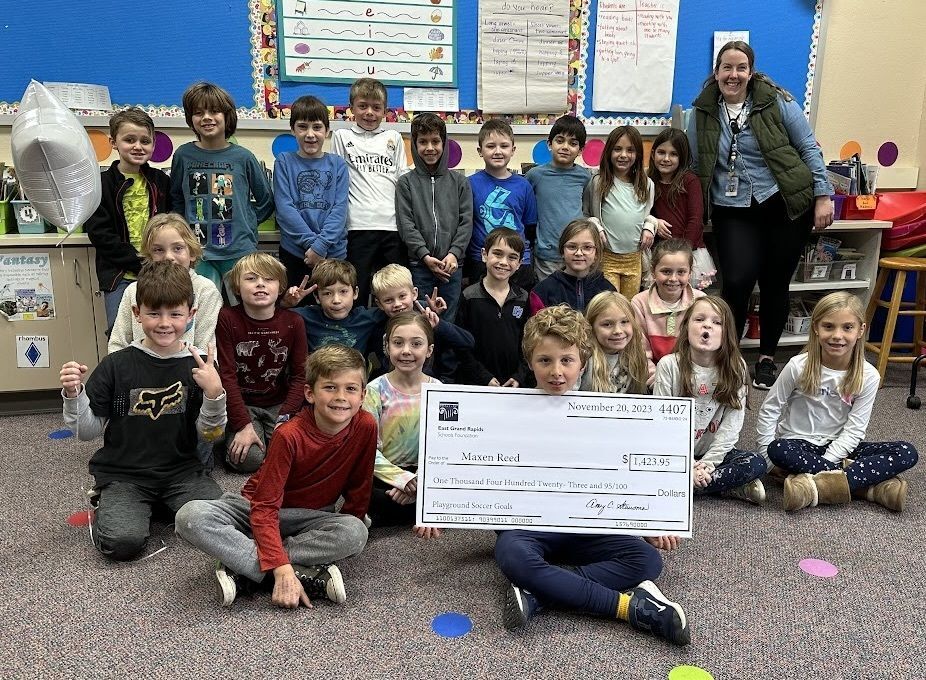 photo of students with big check
