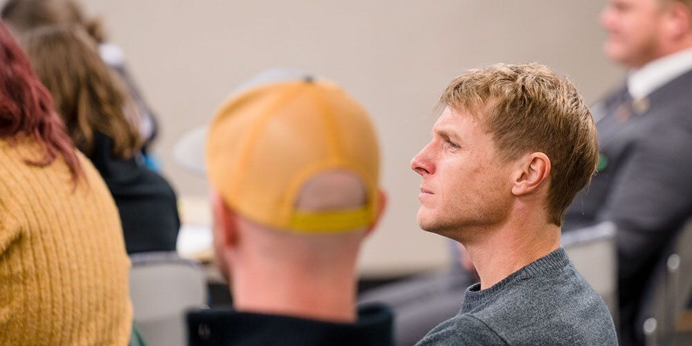 Men paying attention during presentation