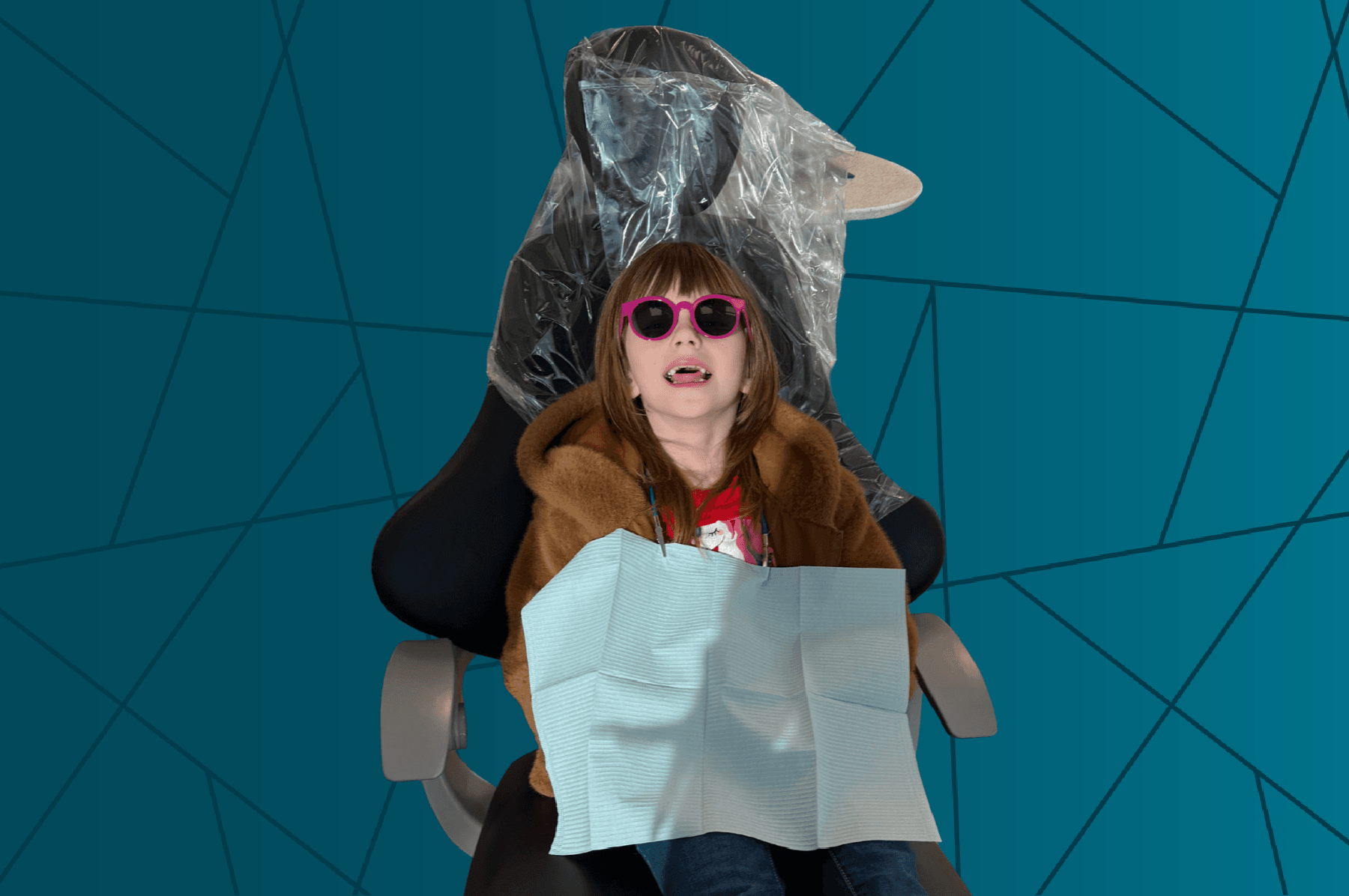 girl in dentist chair with sunglasses 