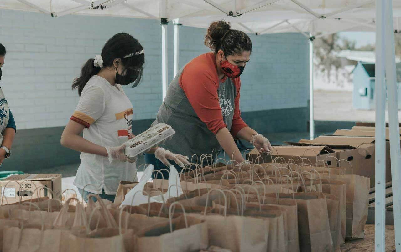 Volunteers packing food bags