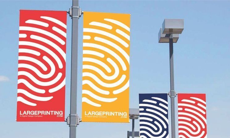 Red Yellow Blue large pole banners hanging from street poles with images of fingerprints