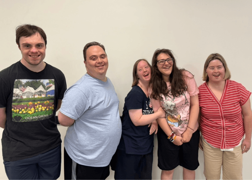Friends from program smiling together