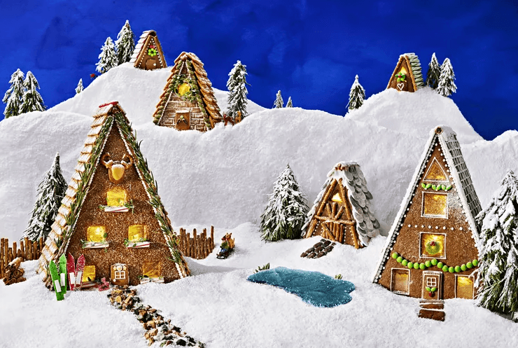Gingerbread houses on a snowy hill