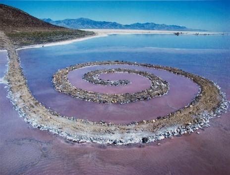 Utah's Spiral Jetty. The sculpture is built of mud, precipitated salt crystals, and basalt rocks. It forms a 1,500-foot-long (460 m), 15-foot-wide (4.6 m) counterclockwise coil jutting from the shore of the lake.[1] Depending upon the water level of the G