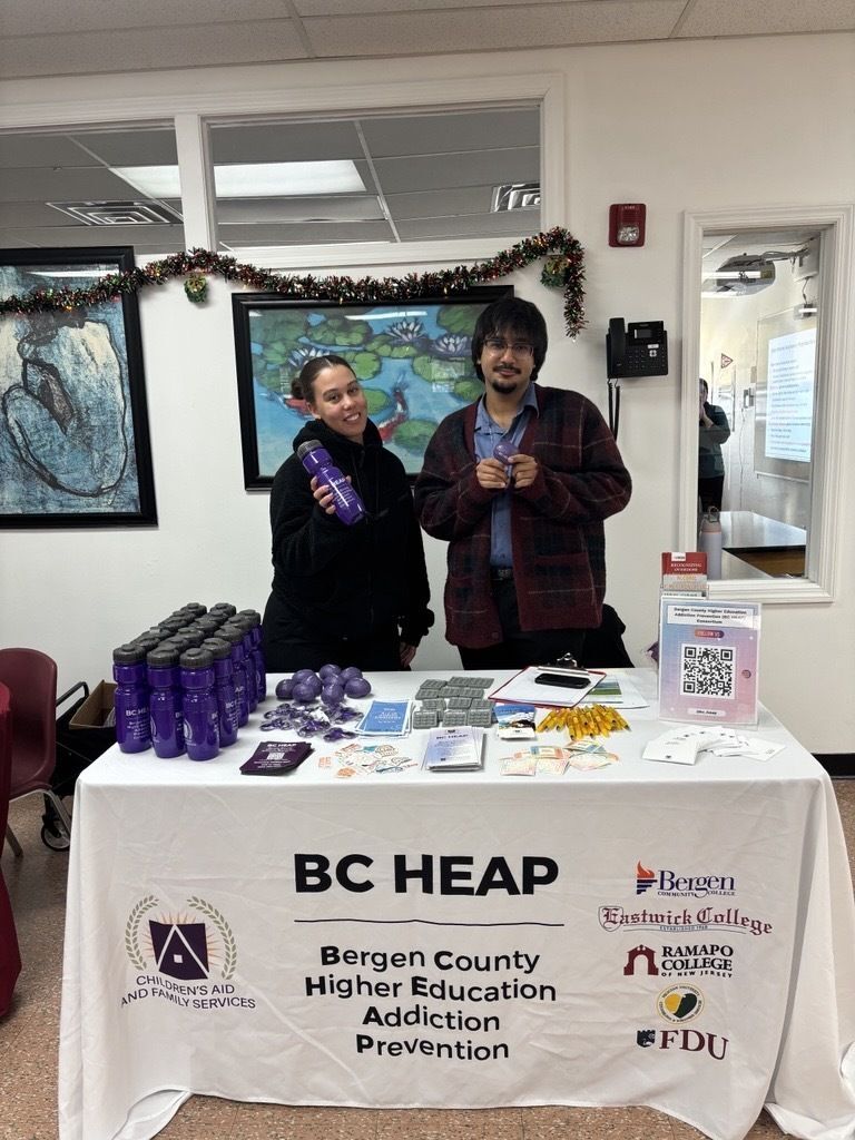 BCHEAP members at a table covered with resources