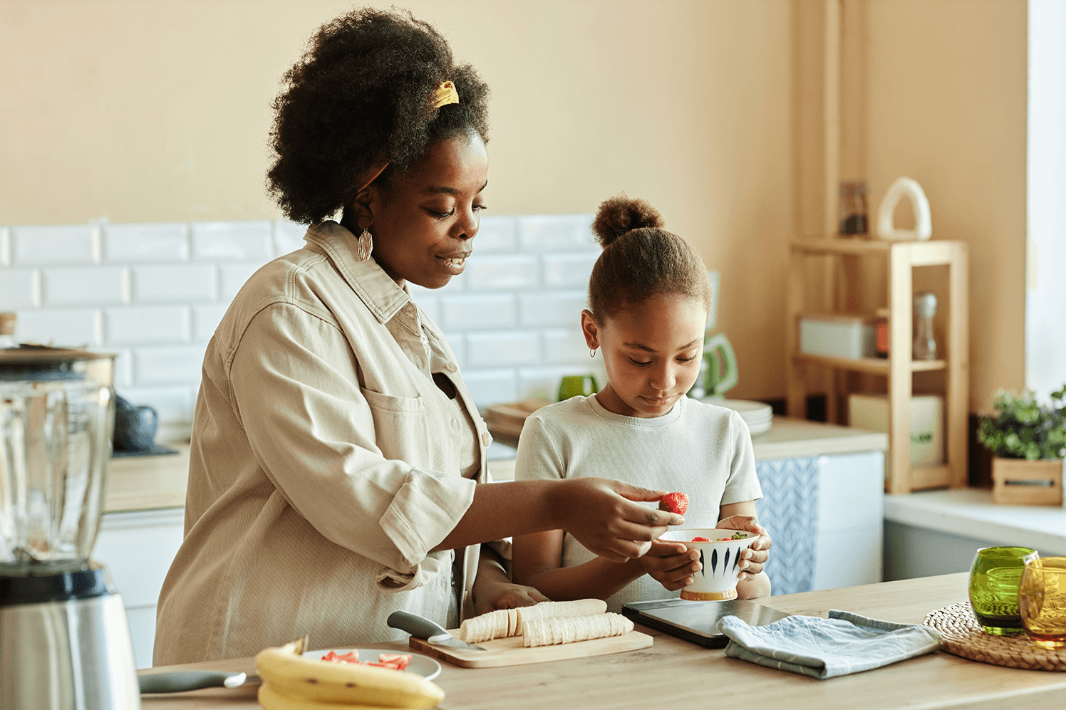 Mother and child prepping fruit