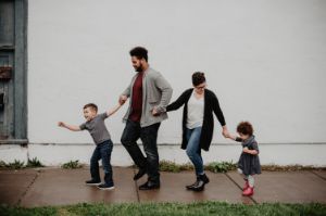 family walking on sidewalk