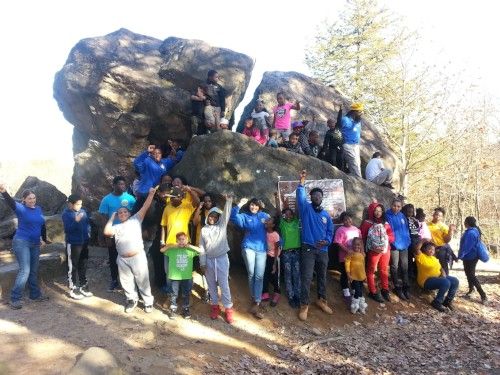Solar Youth Interns and Stewards celebrate after a hike up to Judges' Cave in West Rock Ridge State Park