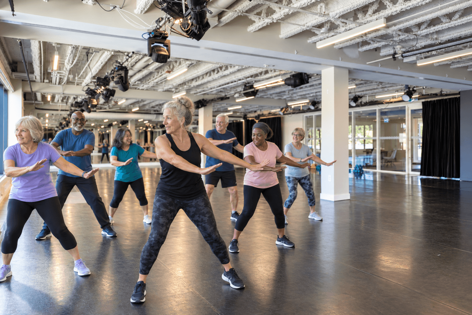 Older adults taking part in a group movement class.