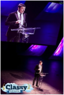 This is a picture of Adam Garone speaking at the Classy Awards