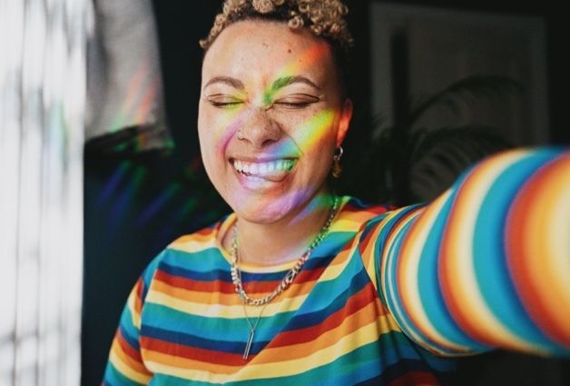 Woman in Rainbow Striped Shirt