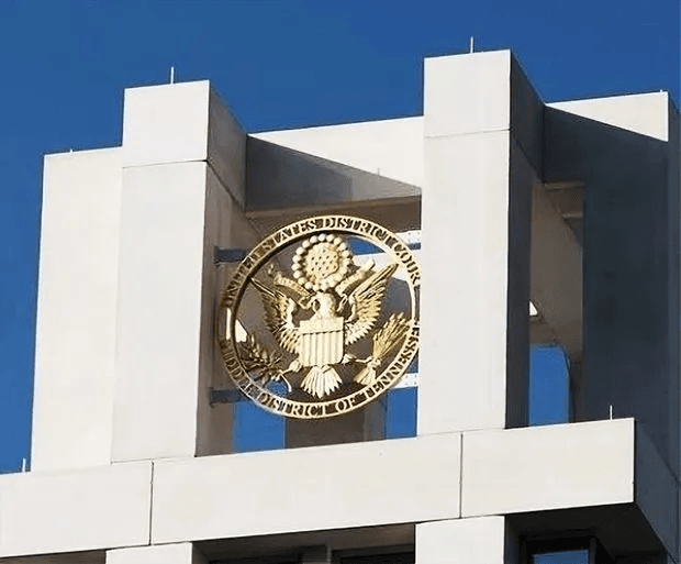 Eight ft diameter 24K gold-leaf gilded District Court Seal emblem on top of Tennessee Courthouse