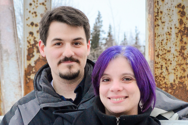Photo of David Koster and a young women with purple hair.