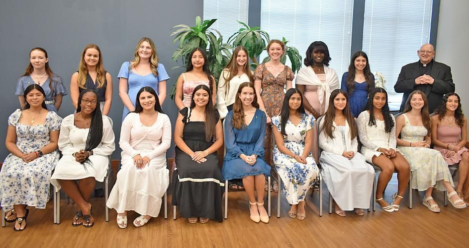 Father Charles E. Notabartolo, diocesan vicar general, is photographed with 18 of the 21 Palm Beach Diocesan Council of Catholic Women Golden Rose recipients after the Mass and reception at the Cathedral of St. Ignatius Loyola Oct. 4, 2025.
