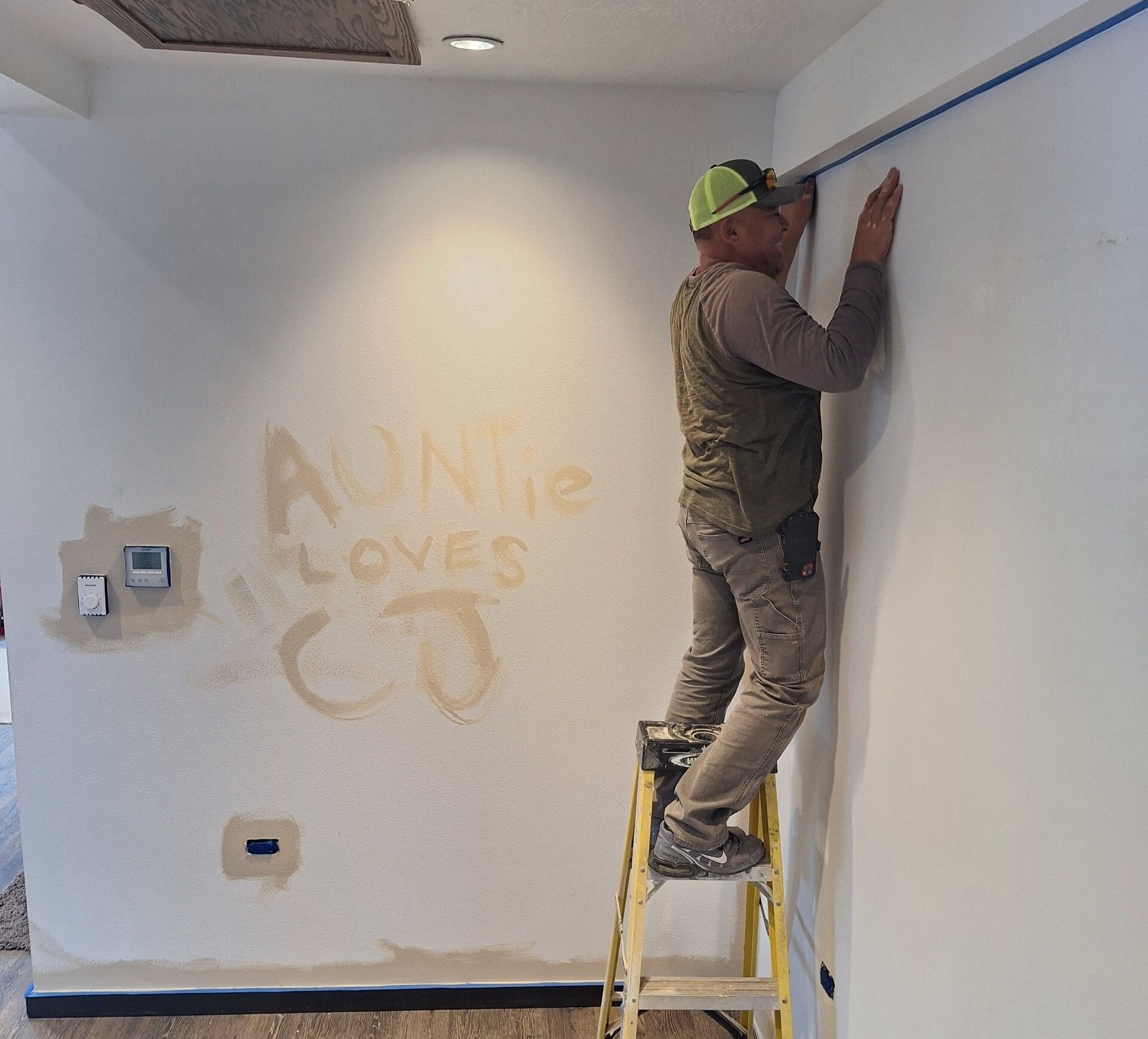Abraham painting his house.