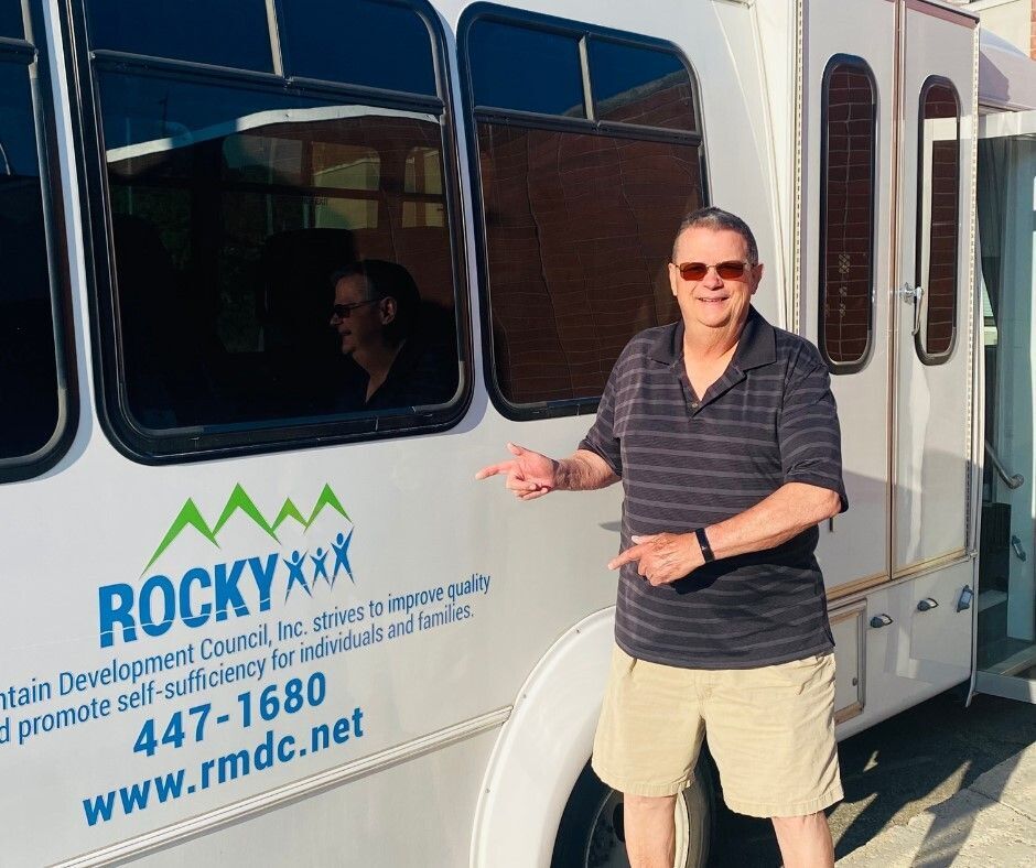 Pictured: Rocky's two bus drivers in front of the RMDC Senior Bus.