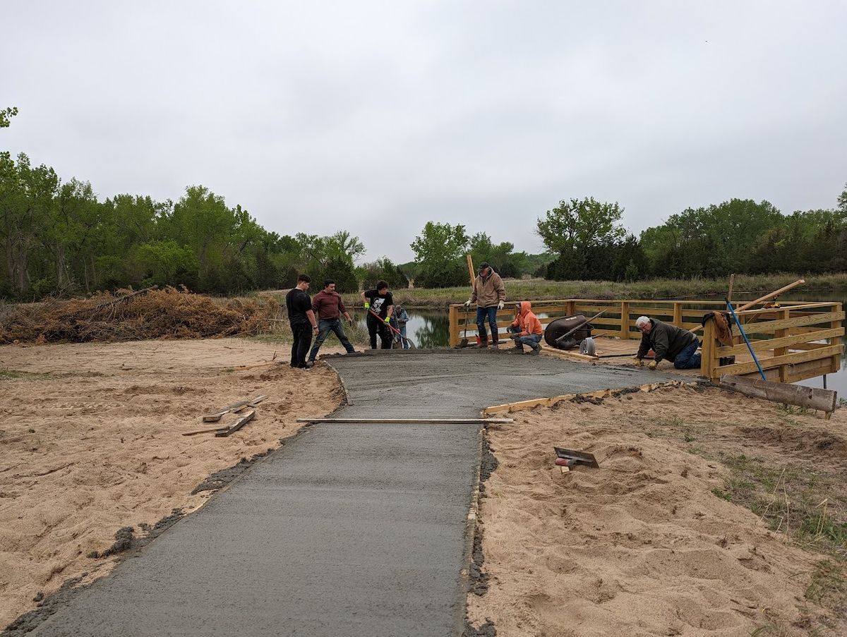 Dedicated volunteers laying the sidewalk for the Sunset Pier at Bader Park