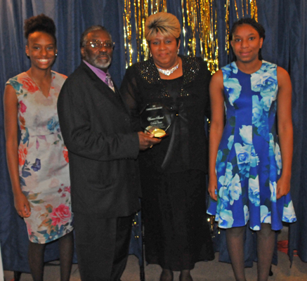 Celeste Dean's daughers and mother, Sheila Dean, accepting her posthumous FCCG Warrior Award on her behalf, with Silas Johnson.