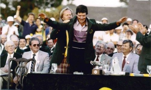 Larry Mize receiving the Masters champion's green jacket from Jack Nicklaus