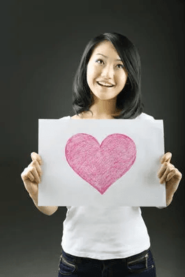 woman with heart sign