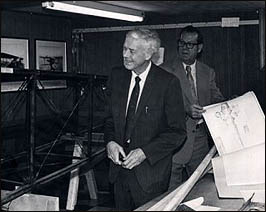 Charles Lindbergh and George Dade examining his Jenny