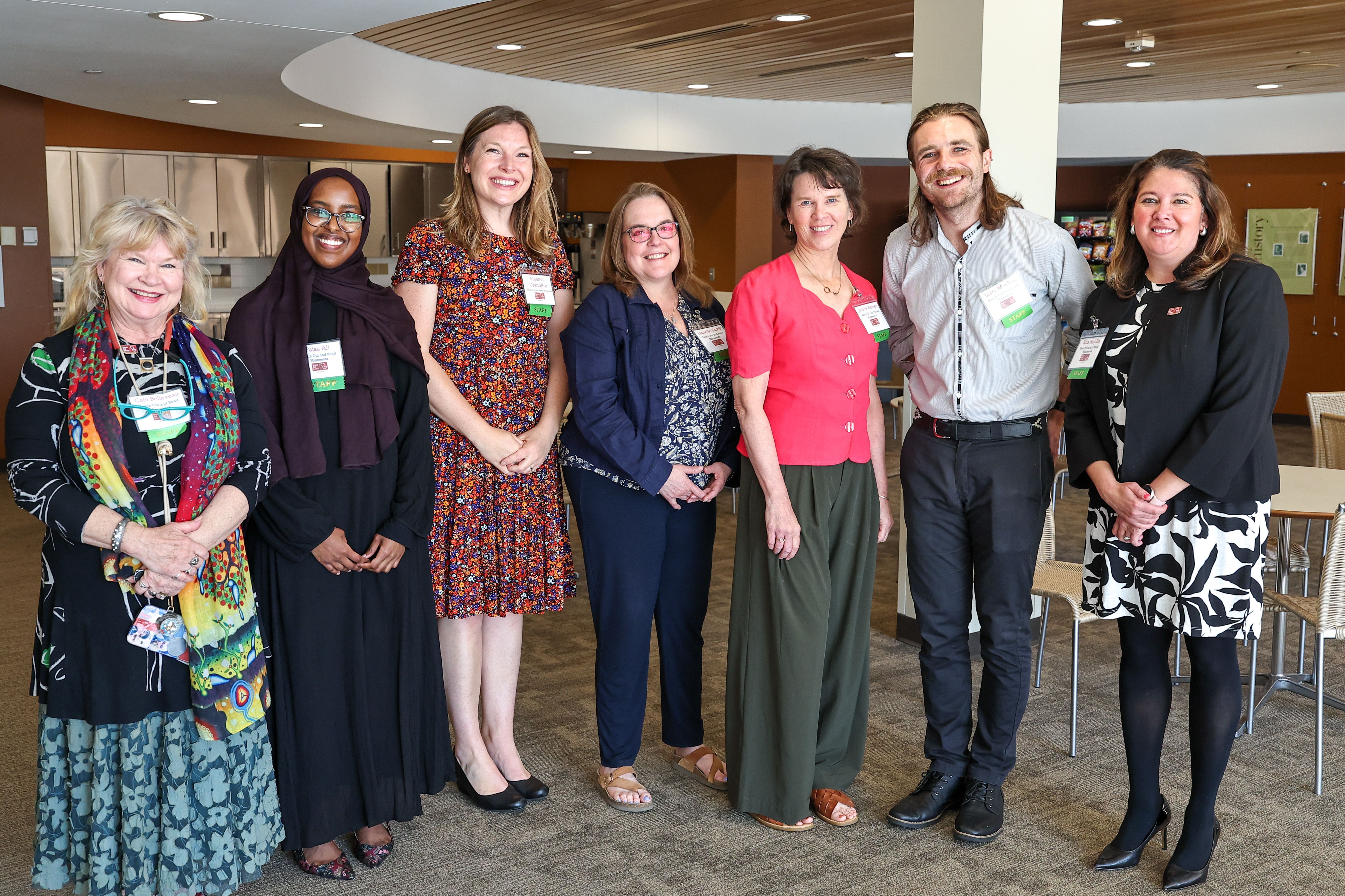 Seven Reach Out and Read Minnesota staff members smile for camera