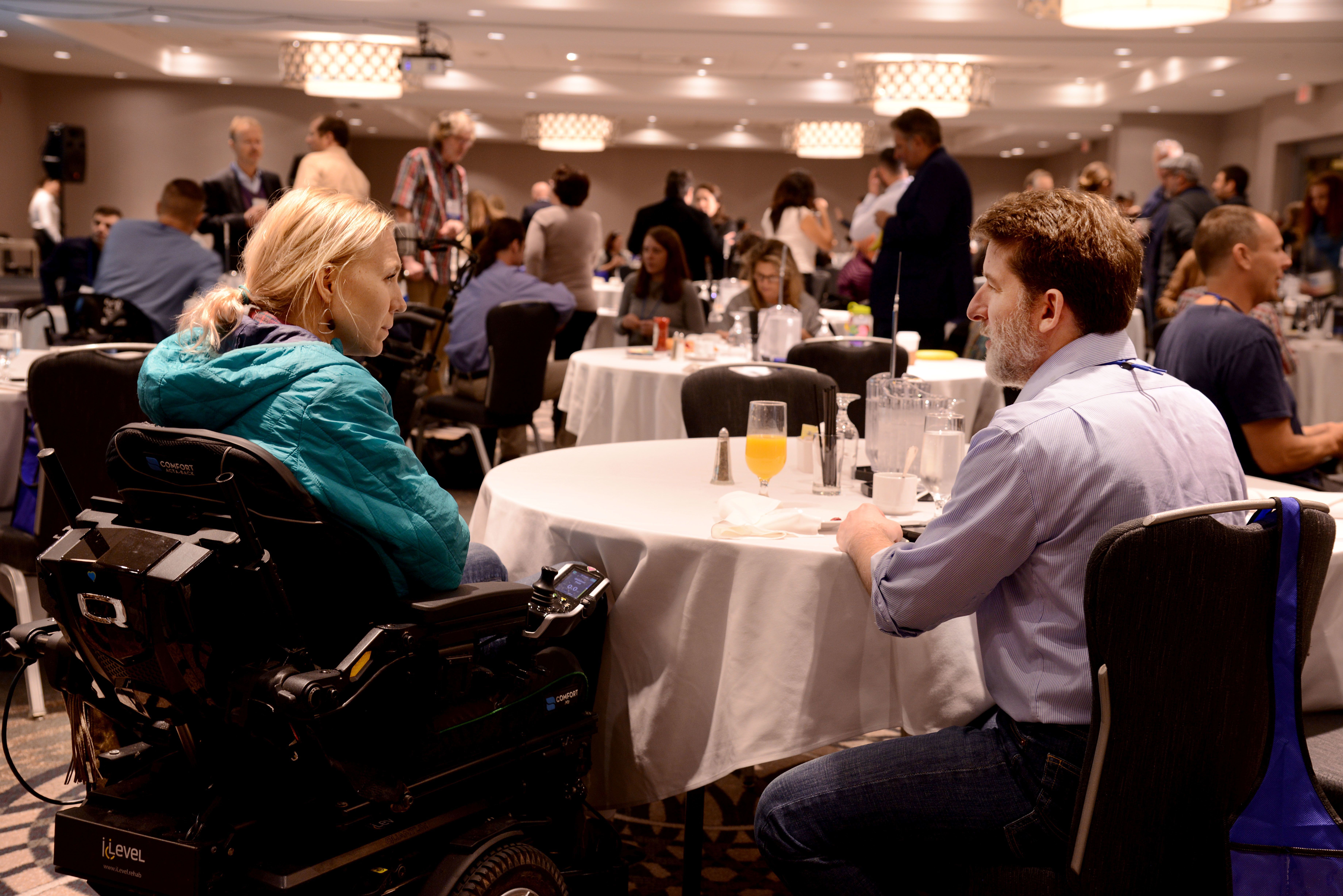 Kelsey Peterson (left) talks with research scientist Dennis Bourbeau (right) 