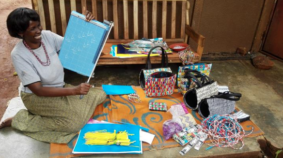 Agatha happily displays her paper cutter (in-kind load from WCFJC)