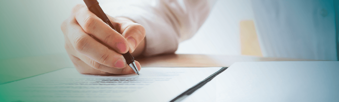 person signing a document