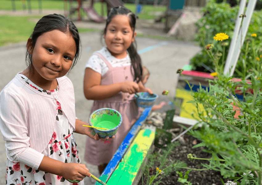 Girls painting flower bad