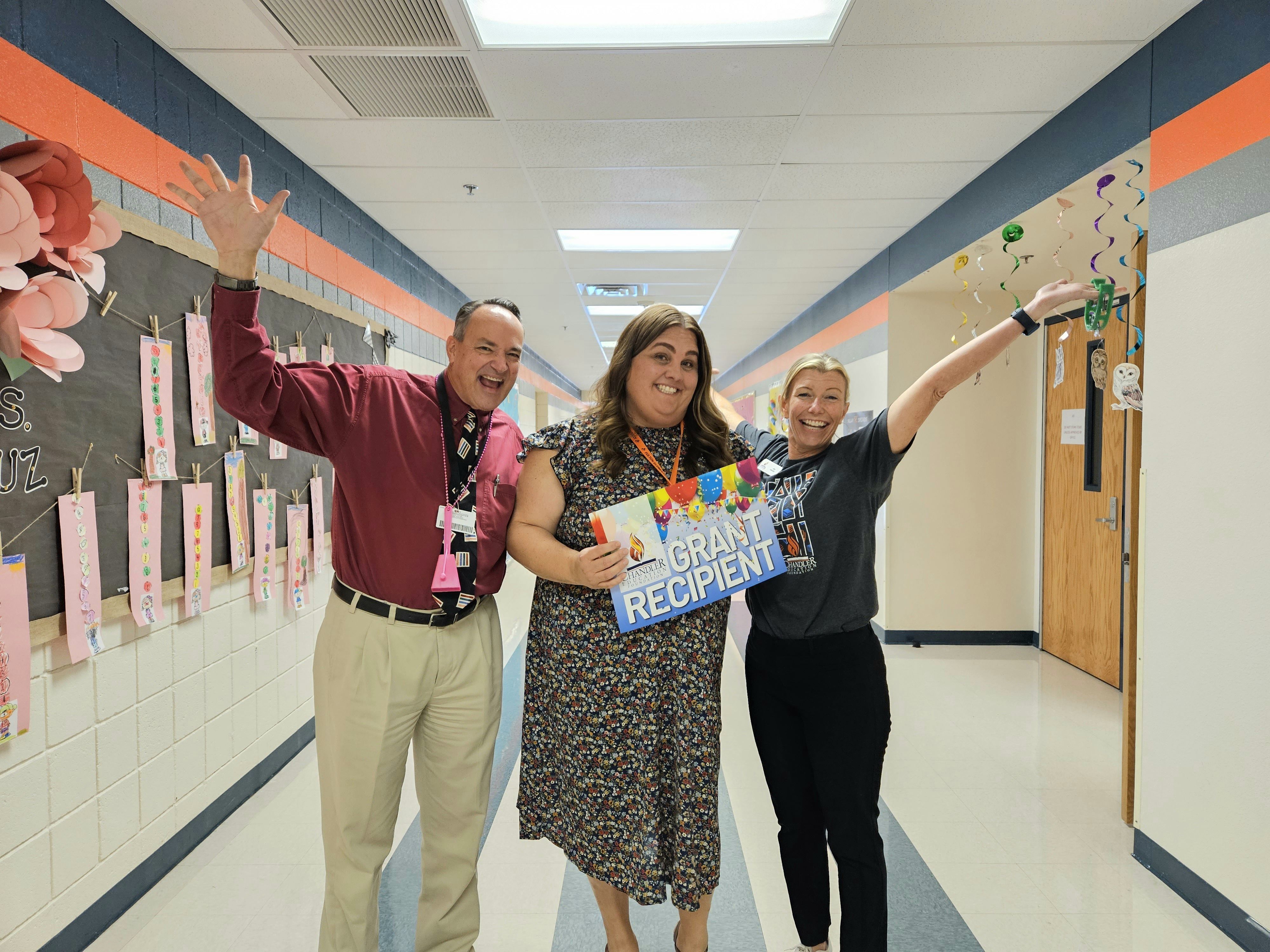 Mr Leo Schlueter, Executive Director of Elementary Education and Ms. Jen Hewitt, Executive Director of the Chandler Education Foundation presenting an enrichment grant for special education sensory resources to Ms. Gross of Fulton Elementary School. 